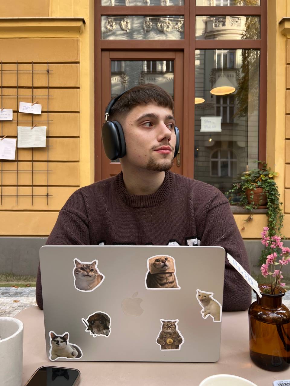 Roman working at a café with his MacBook